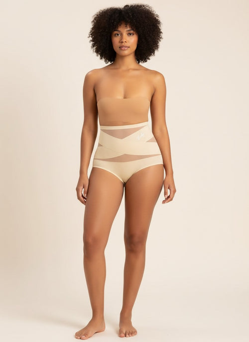 Model wearing YACO CurveFit beige high-waisted shaping bottoms with breathable mesh panels for a smooth silhouette.