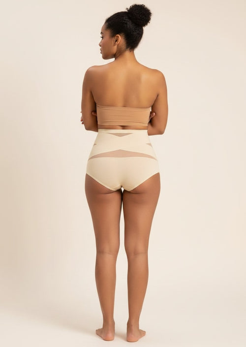 YACO CurveFit beige high-waisted shaping bottoms with breathable mesh panels worn by a model from the back view