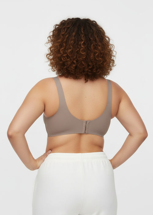 YACO Jelly push up bra in taupe, featuring a seamless wire-free back design on a woman with curly hair.