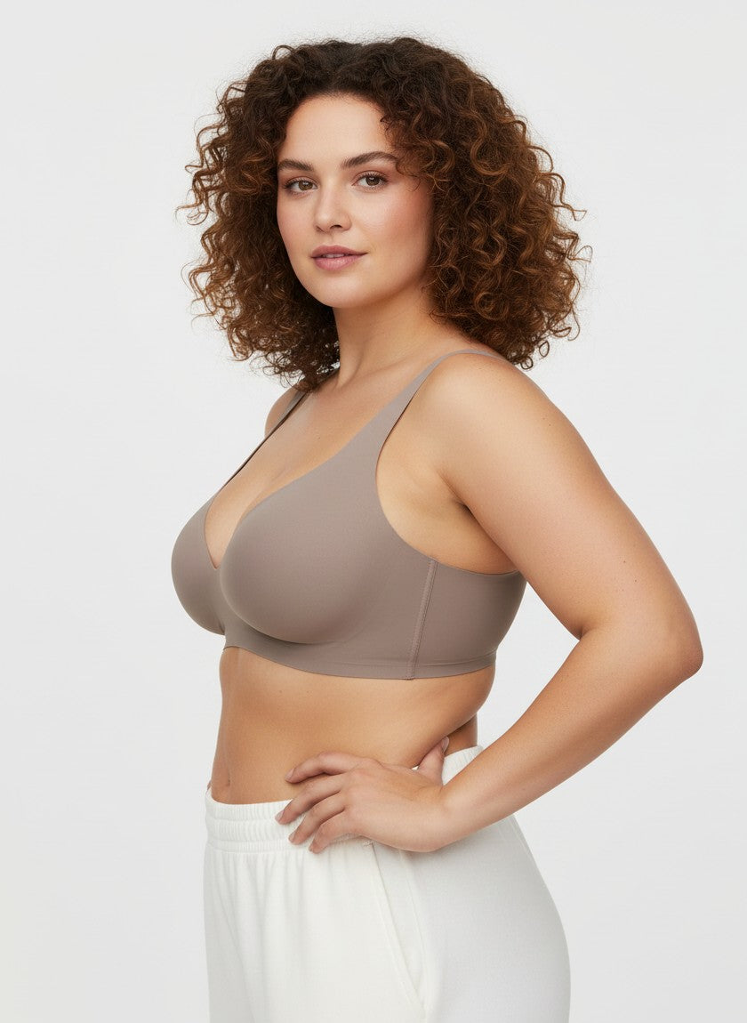 YACO Jelly push up bra in taupe, featuring a seamless wire-free design worn by a woman with curly hair.